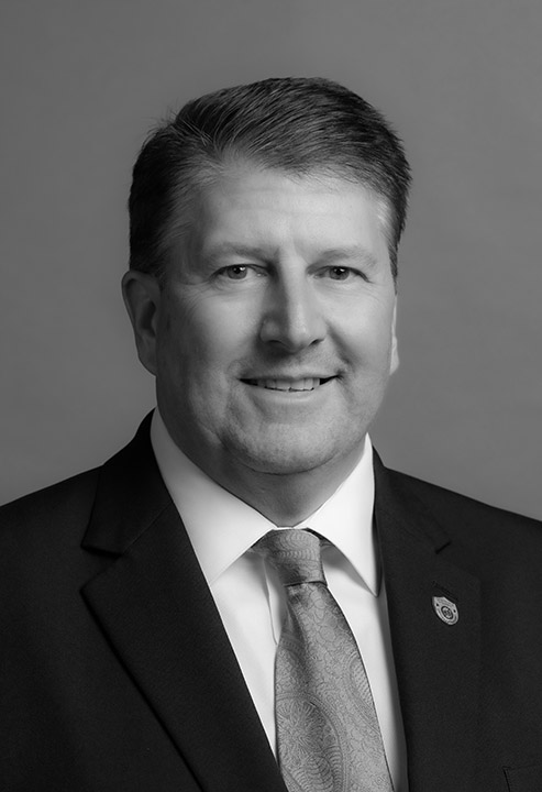 "smiling man in suit"